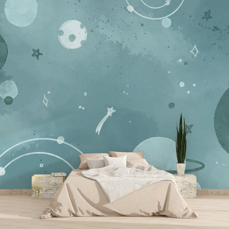 Celestial mural wallpaper displayed in a cozy nursery with gentle lighting