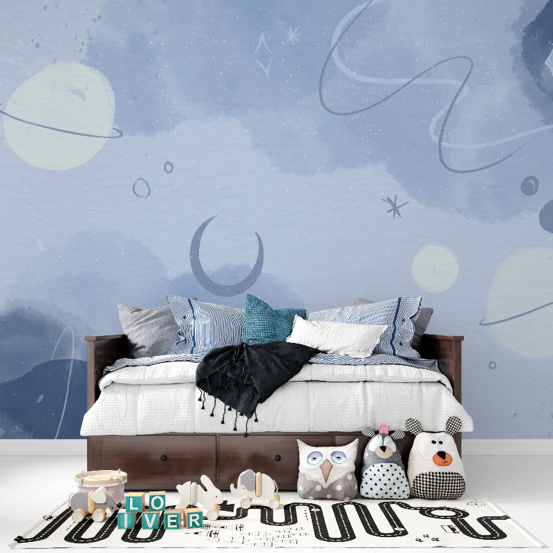 Space theme wallpaper creating a magical atmosphere in a cozy nursery with soft lighting