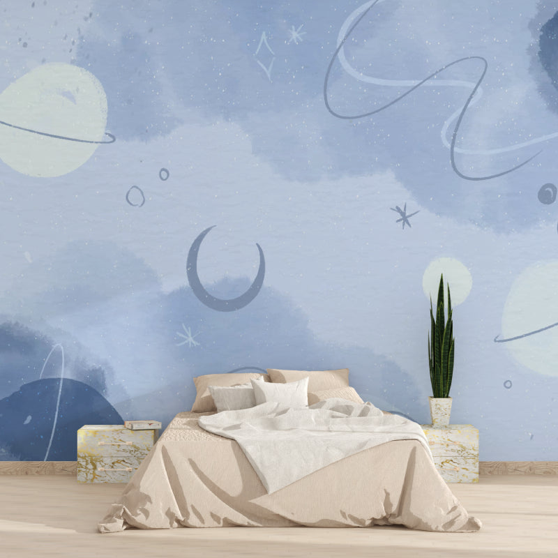 Space themed wall mural showcasing celestial elements in a teen's study area