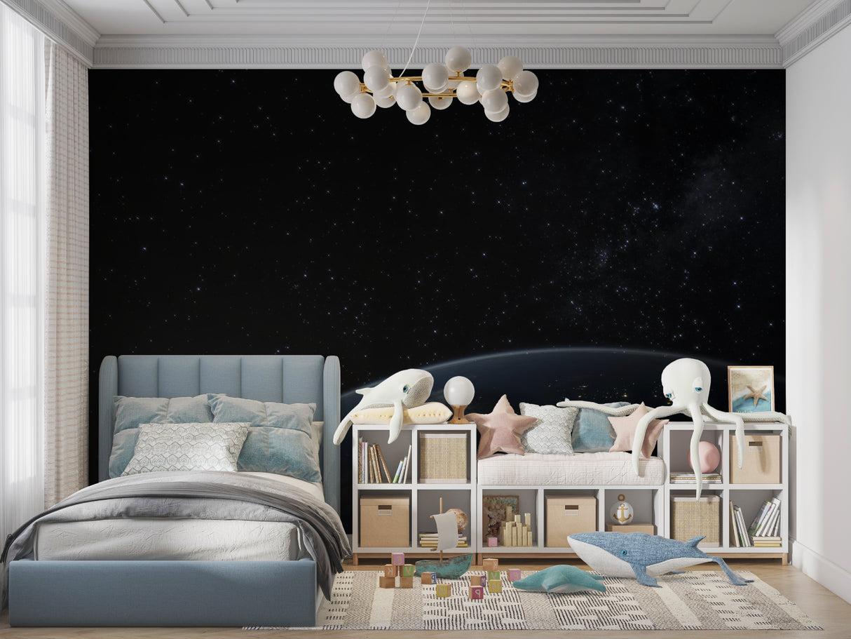 Space themed wall mural in gaming room with planet Earth and starry night