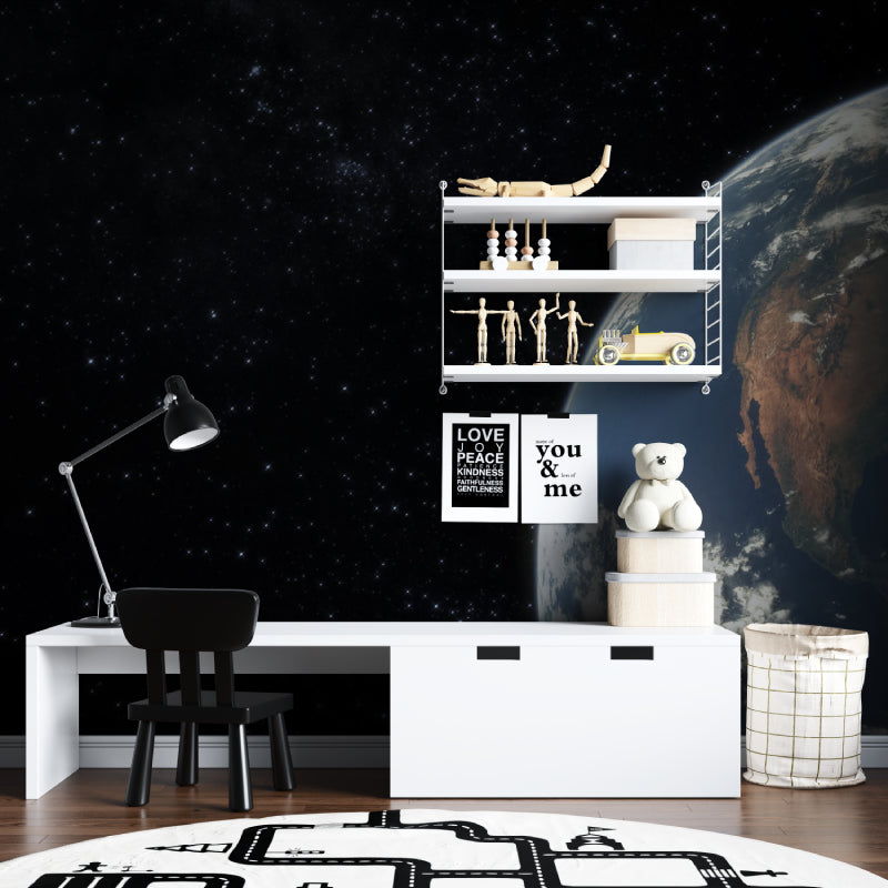 Space wallpaper with Earth view creating depth in modern living room with grey sofa