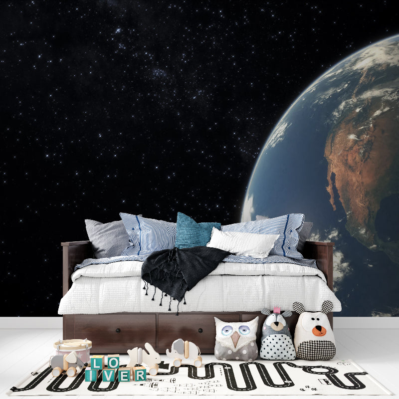 Earth view space wallpaper making statement wall in home office setup
