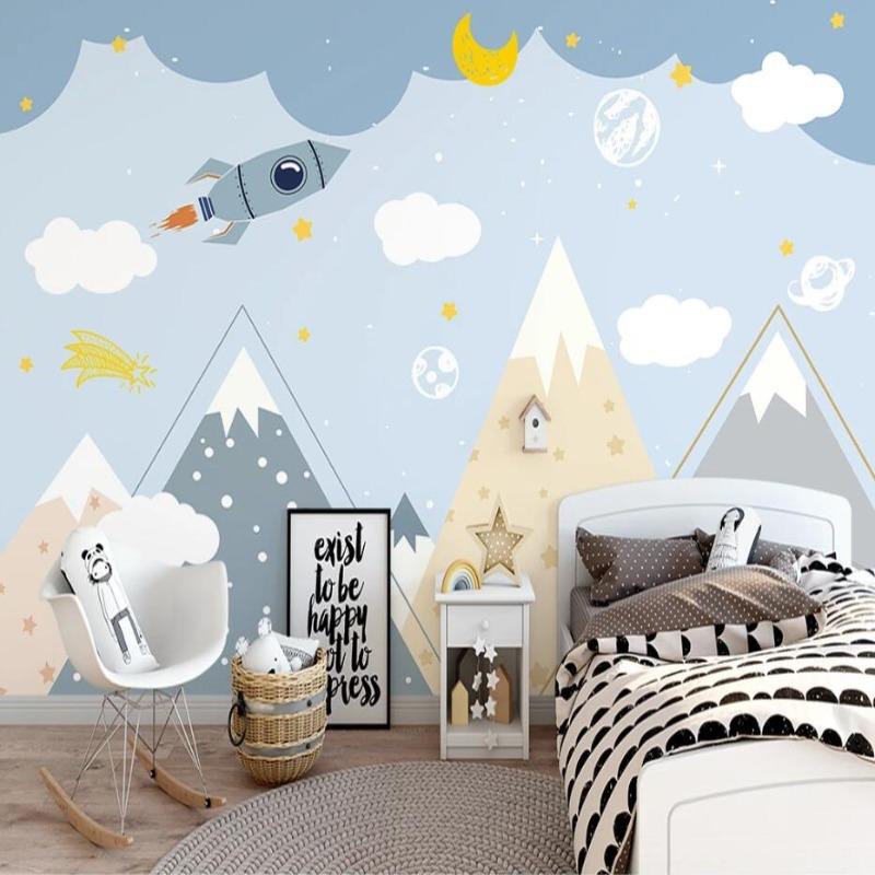Space adventure wallpaper creating a dreamy atmosphere in a modern nursery with soft lighting and wooden furniture