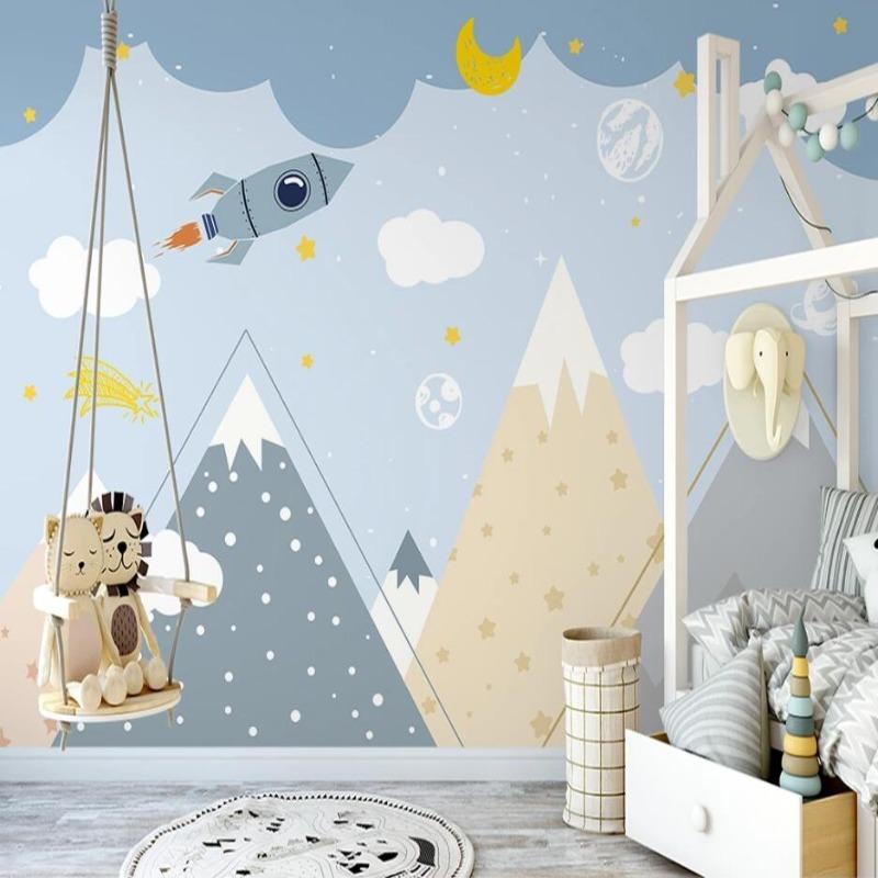 Mountain and rocket wallpaper displayed in a cozy reading nook with plush cushions and star-shaped lighting