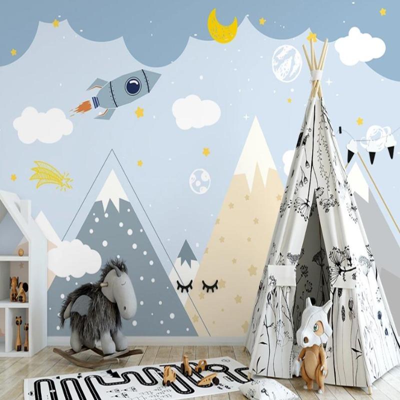 Space themed wall mural bringing adventure vibes to a child's bedroom with matching decor