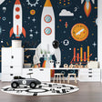 Space rocket wallpaper bringing adventure to a modern kids bedroom with blue and orange accents