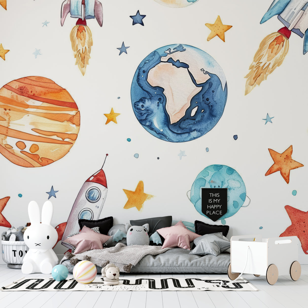 Space wallpaper mural in modern nursery with rocking chair and starry mobile
