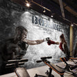 Boxing wallpaper displayed in modern home gym, showing dramatic black and white design