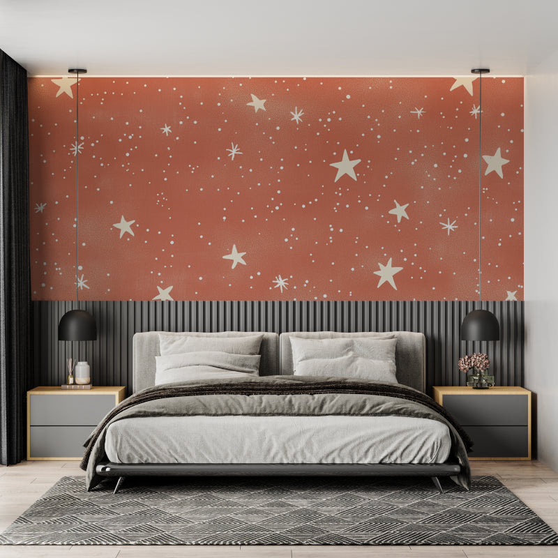 Terracotta and gold stars mural creating a cozy reading nook atmosphere