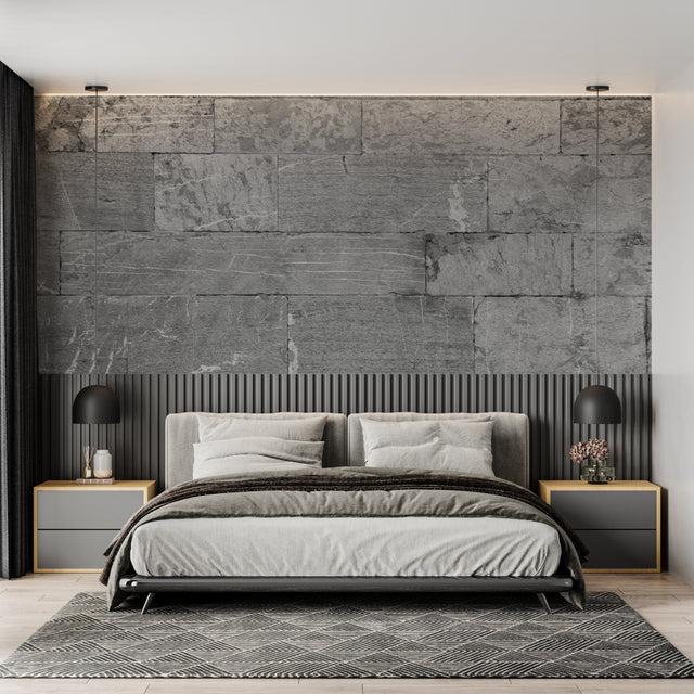 Modern grey stone block wallpaper in contemporary living room with minimal furniture
