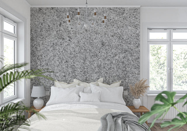 Modern grey stone wallpaper in luxury living room setting, creating an elegant accent wall behind modern furniture