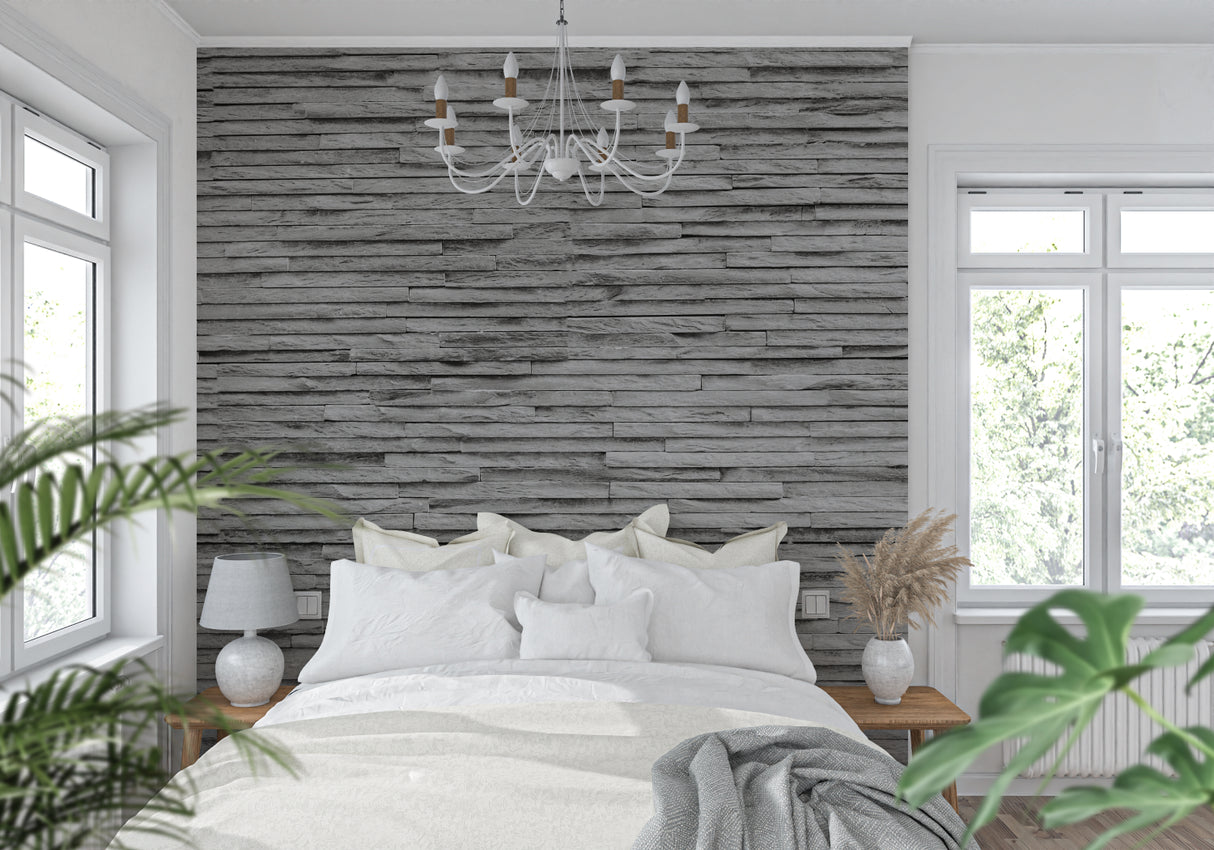Stone wall mural creating dramatic backdrop in contemporary dining room