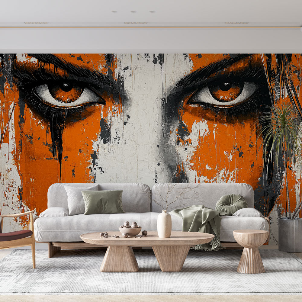 Street art portrait wallpaper creating dramatic impact in modern living room with orange and black tones