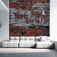 Street art motivational wallpaper creating impact in modern home gym with exercise equipment and natural lighting