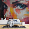 Street art mural wallpaper creating bold impact in modern living room with high ceilings and minimal furniture