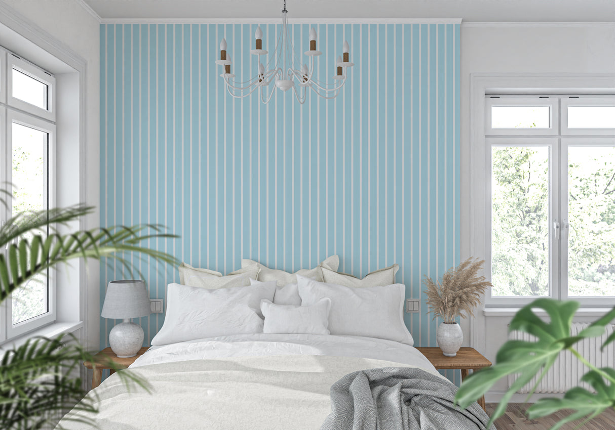 Vertical blue stripe wallpaper in bedroom making the space feel taller and more elegant