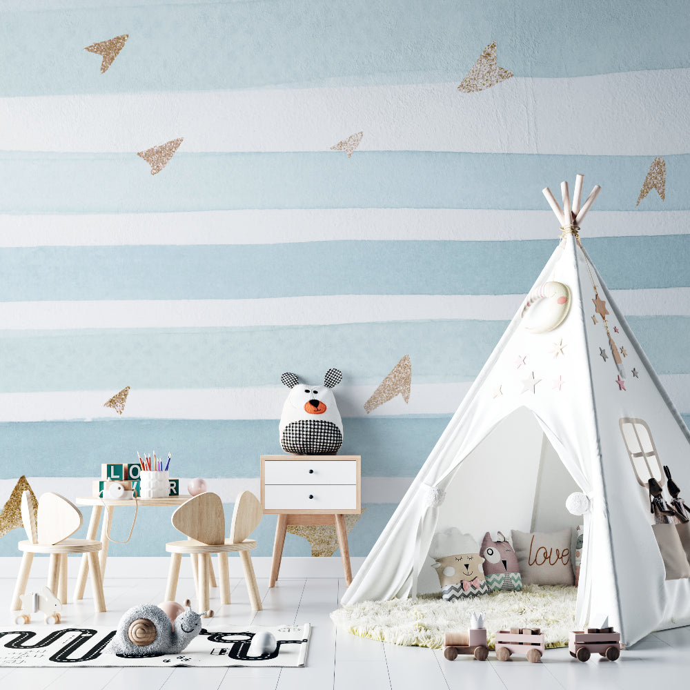 Modern blue stripe wallpaper with metallic accents shown in a playroom with natural lighting