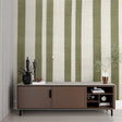 Green striped wallpaper in a bright modern living room, creating an airy and spacious feel
