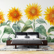 Sunflower wall mural bringing warmth to a bright modern dining room with white furniture and natural light