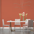 Modern terracotta wallpaper in bright living room with minimalist furniture