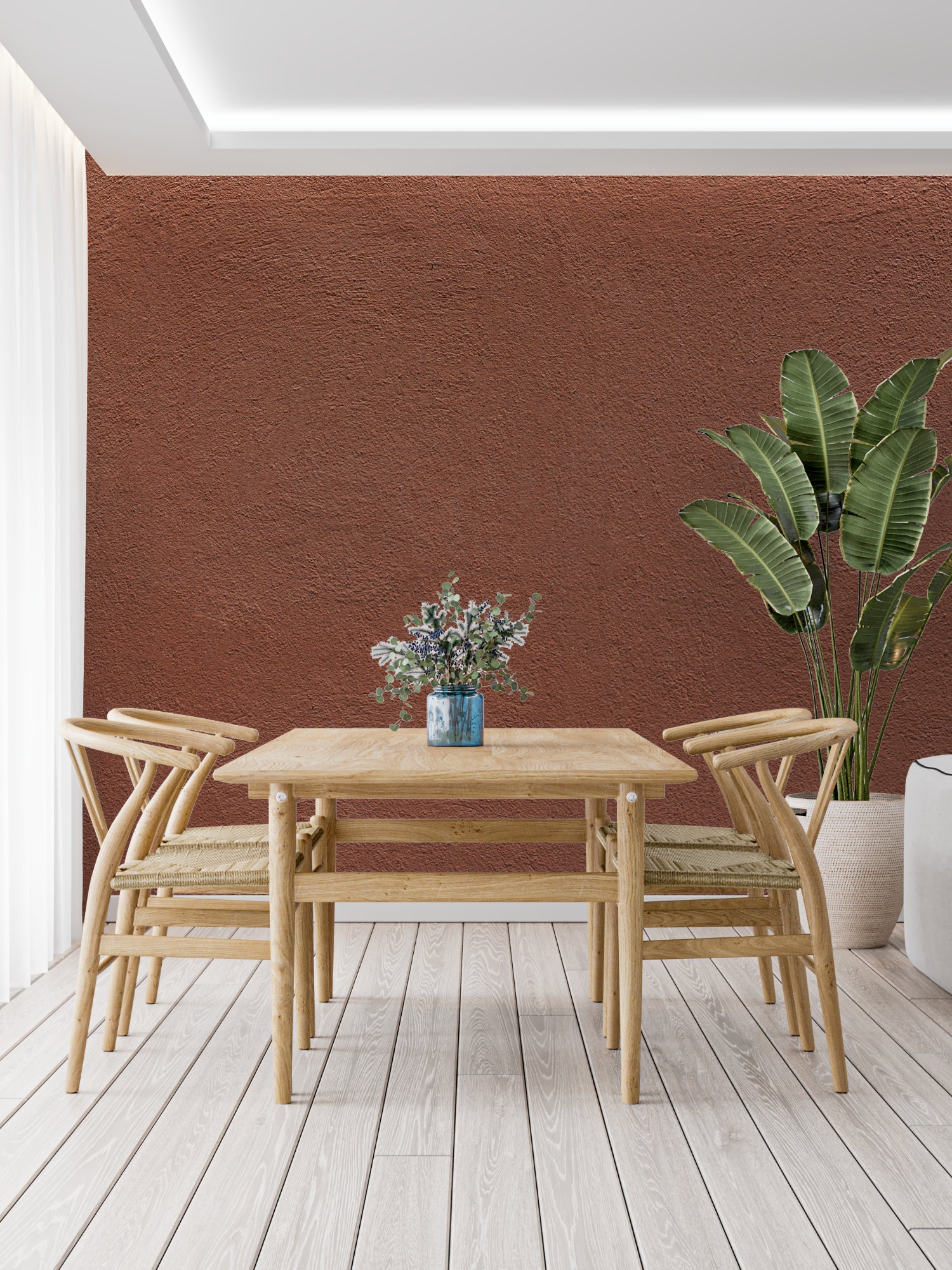 Home office with terracotta wall mural showing natural light play on textured surface