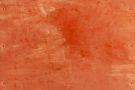 Close-up of terracotta wallpaper design file showing rich texture and warm earth tones