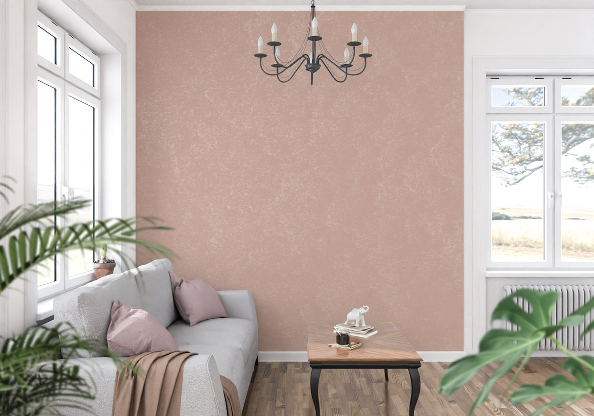 Dining room with pink terracotta wall mural in evening light