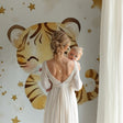 Sweet Tiger Nursery Wallpaper showcased in a modern nursery with rocking chair and soft lighting