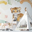 Baby tiger wallpaper creating a cozy atmosphere in a modern nursery with soft lighting