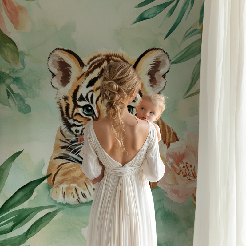 Jungle tiger mural in baby room with wooden accents and pastel decor