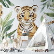 Tiger cub wallpaper mural styled in modern nursery with rocking chair and soft toys