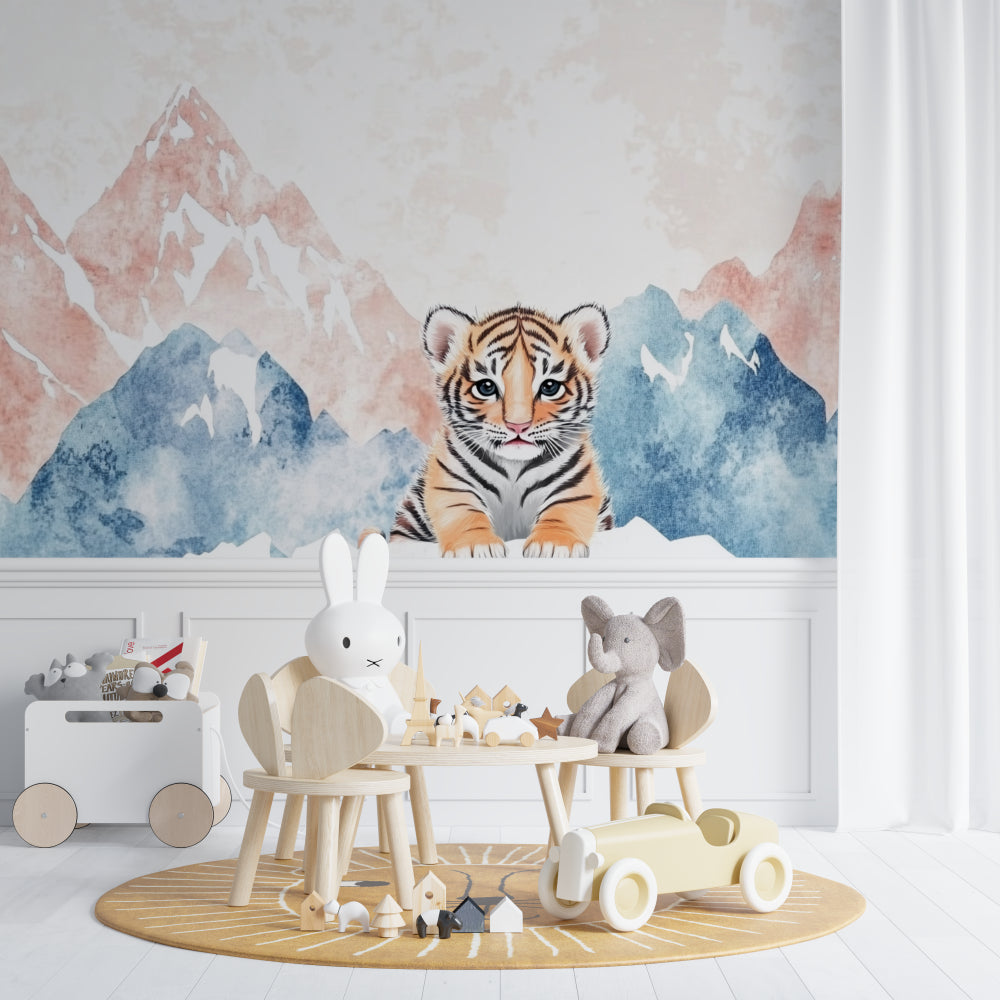 Pink and blue tiger mountain mural in children's reading nook with cozy chair