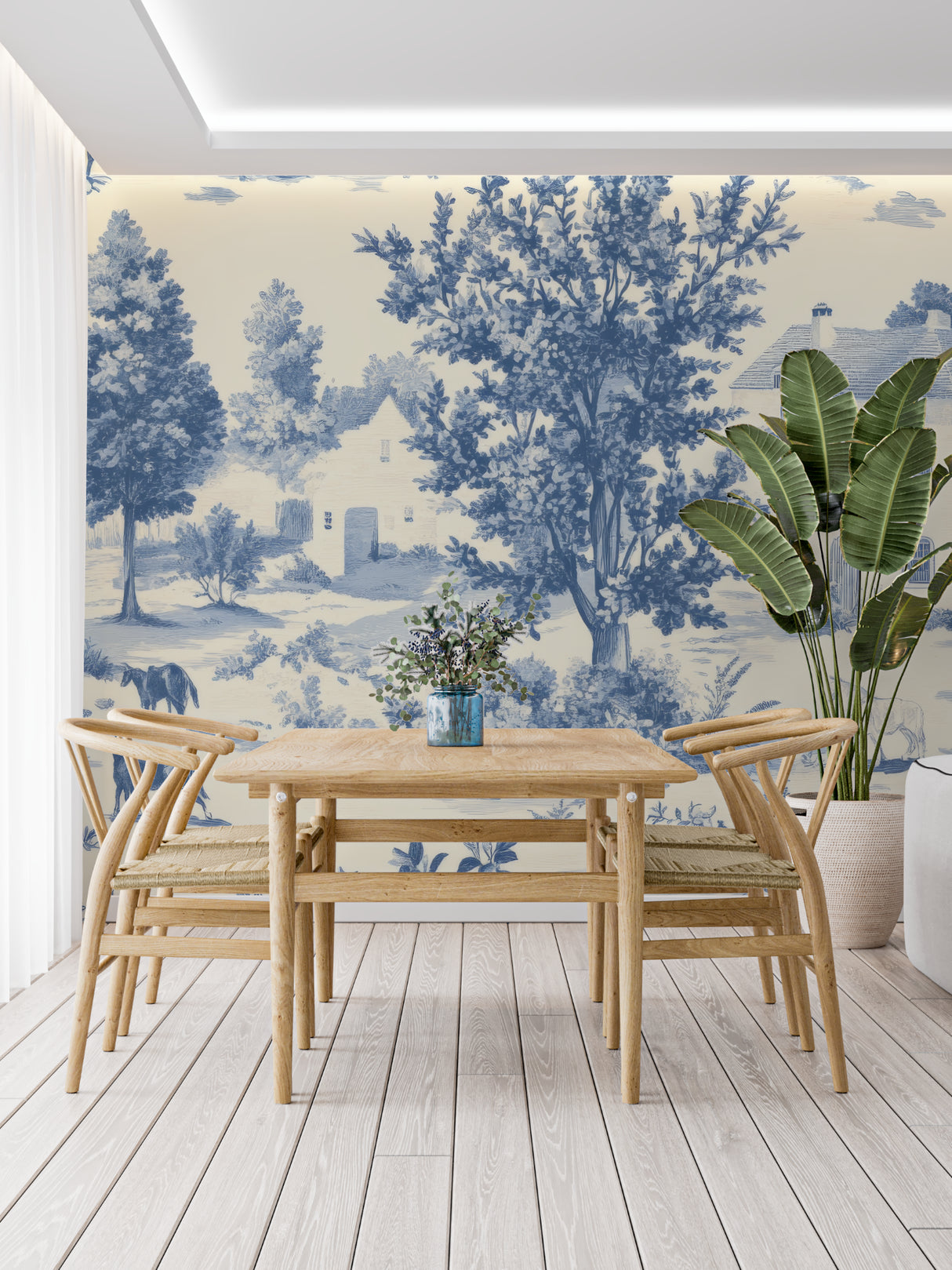 Living room accent wall with classic blue toile pattern and comfortable seating
