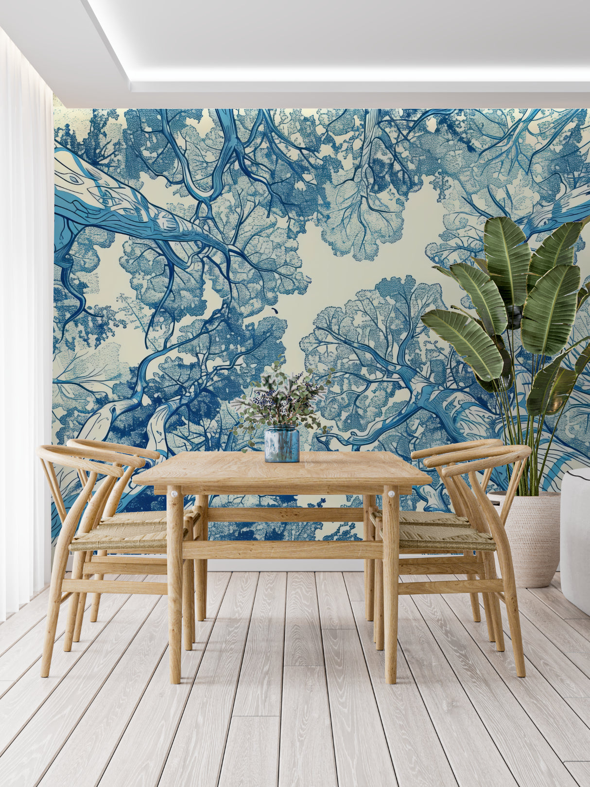 Blue botanical tree mural adding height to a cozy bedroom setting