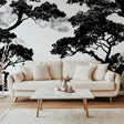 Black and white tree wallpaper creating drama in modern living room with grey sofa