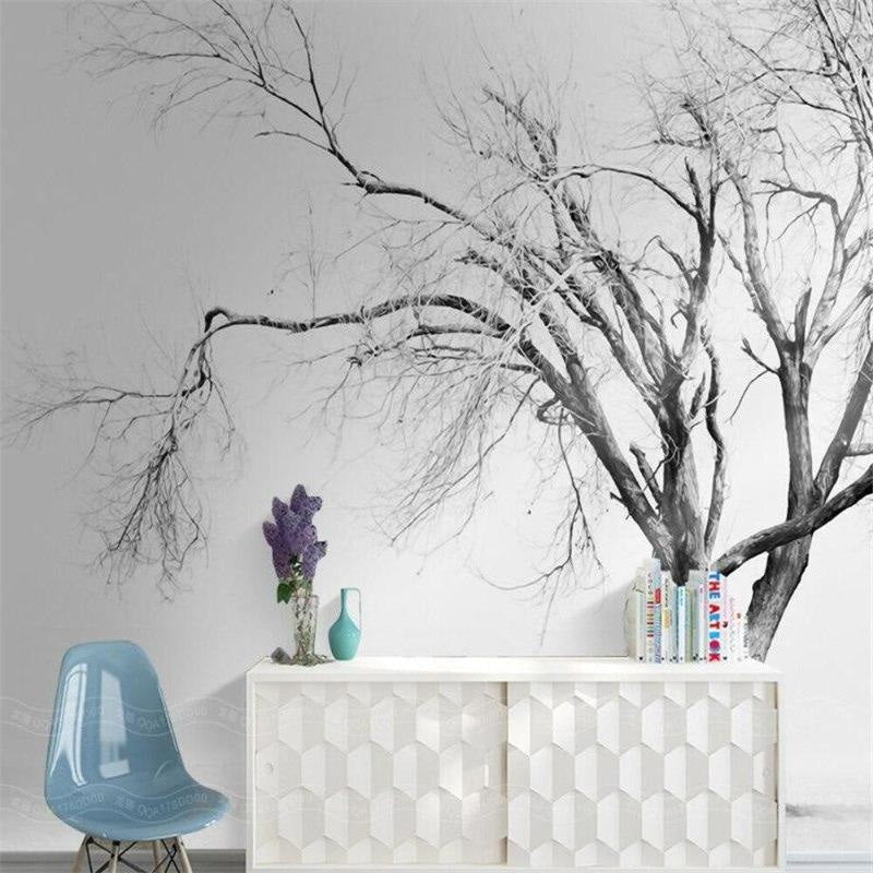 Winter forest mural in a minimalist bedroom showing scale and dramatic contrast