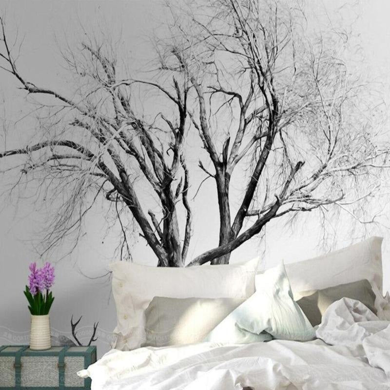 Black and white tree design adding sophistication to a dining room with pendant lighting