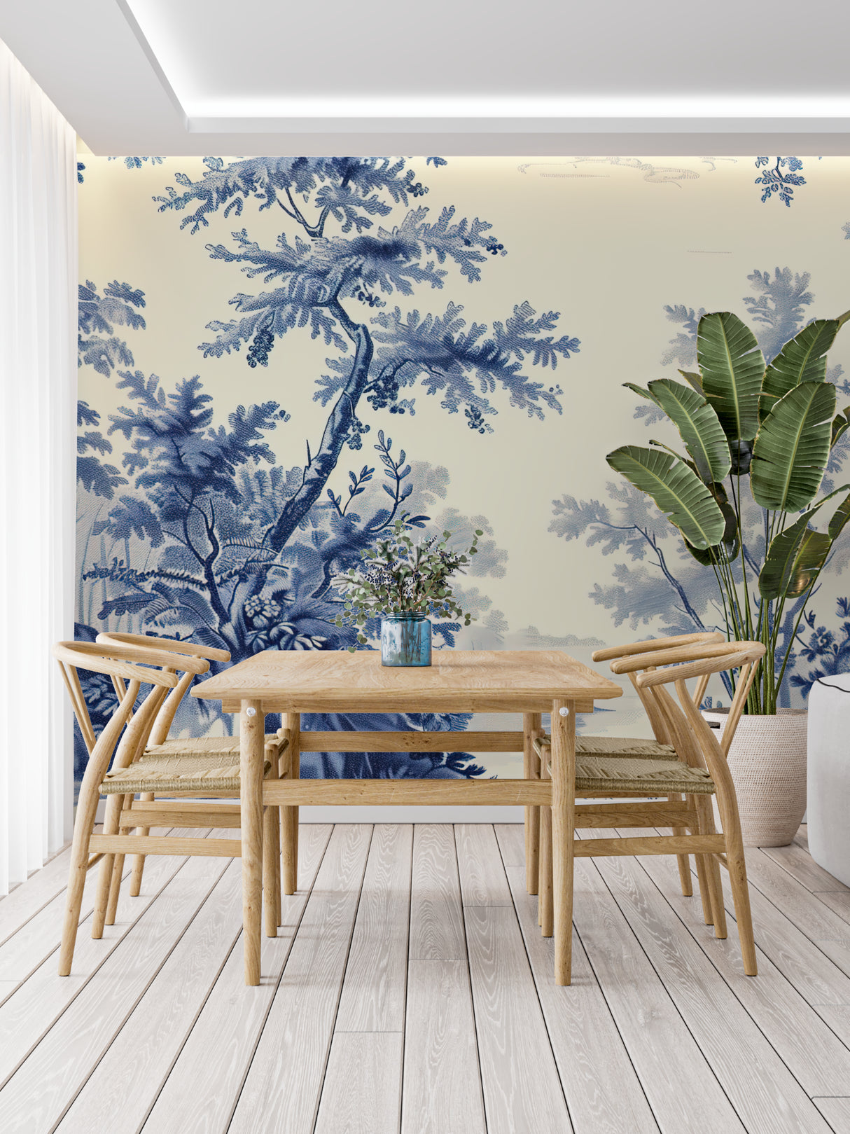 French blue Toile pattern mural creating a cozy reading nook with leather armchair