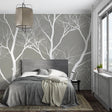 White tree branch wallpaper in modern living room creating serene atmosphere