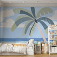 Tropical beach wallpaper with palm tree creating a calm atmosphere in a modern living room with white furniture