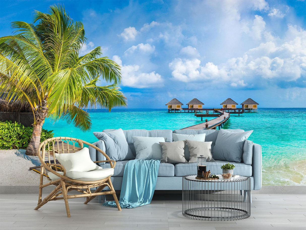 Tropical beach wallpaper creating a stunning focal point in a modern living room with white furniture