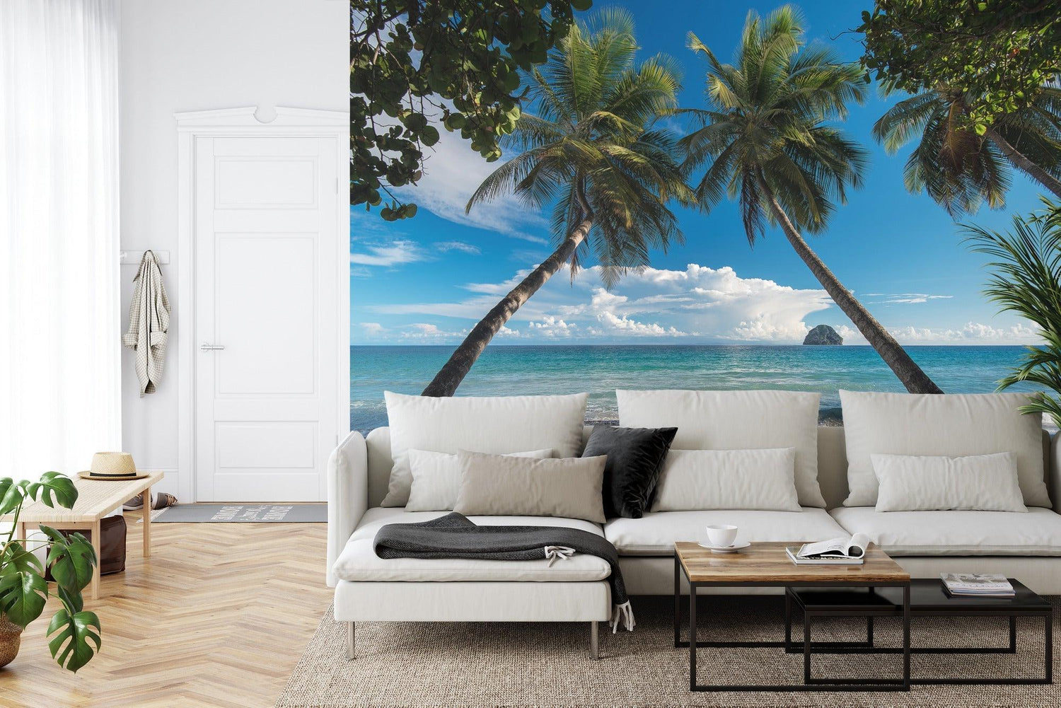 Beach scene mural wallpaper in master bedroom showing palm trees and ocean view