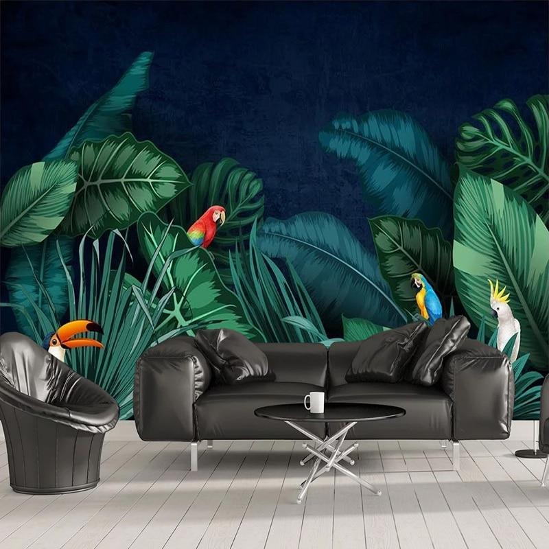 Tropical birds wallpaper creating drama in a modern living room with blue accent lighting