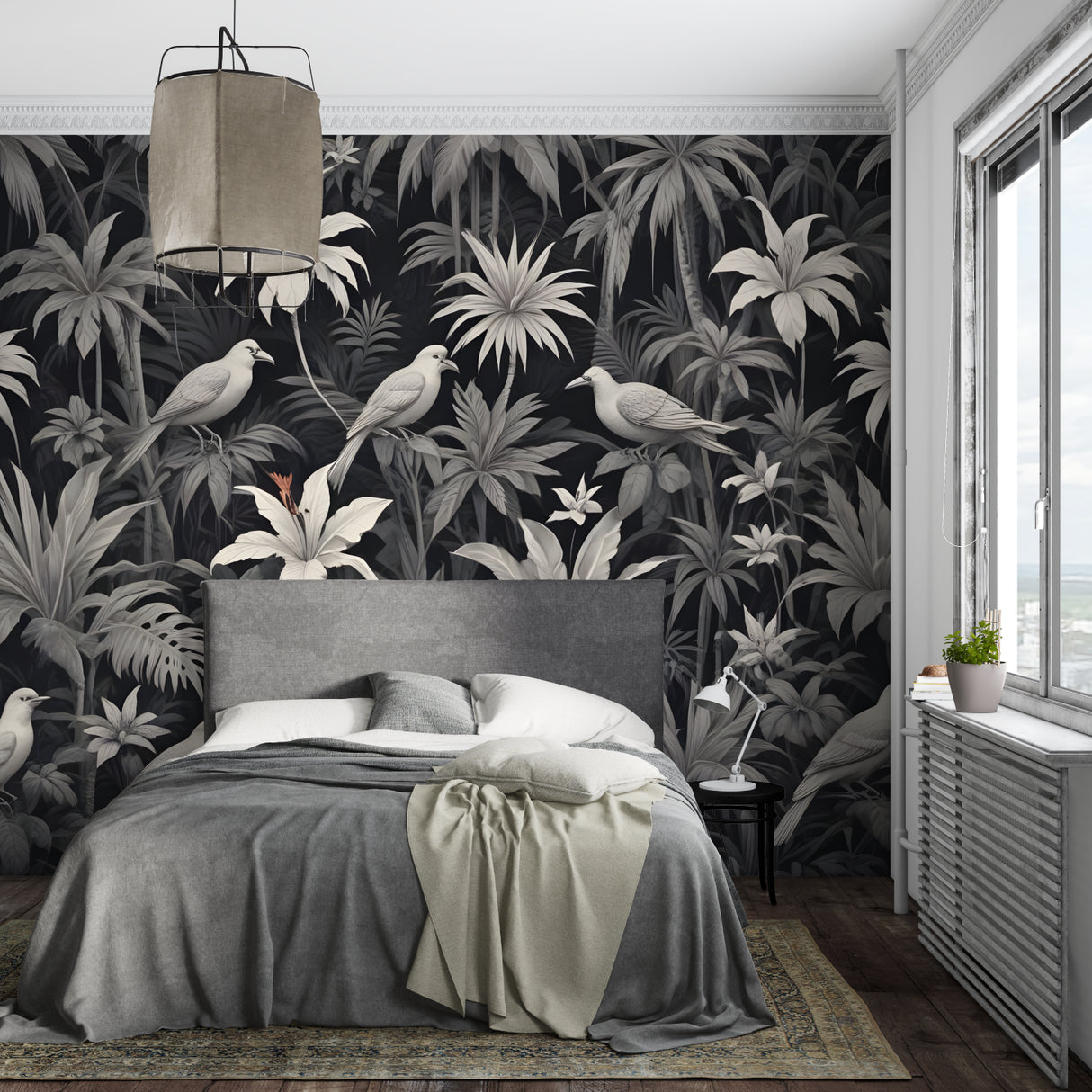 Monochrome jungle wallpaper making a statement in a bright dining room with pendant lights