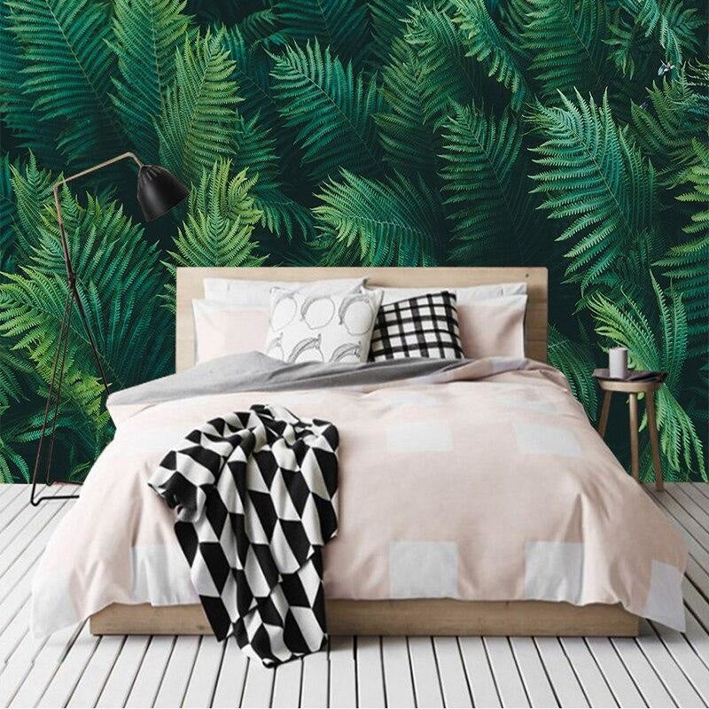 Green fern wall mural adding depth to a cozy bedroom setting