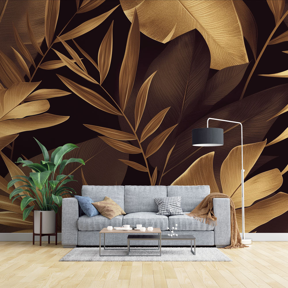 Tropical gold leaf wallpaper in modern dining room creating luxurious atmosphere with black and metallic accents