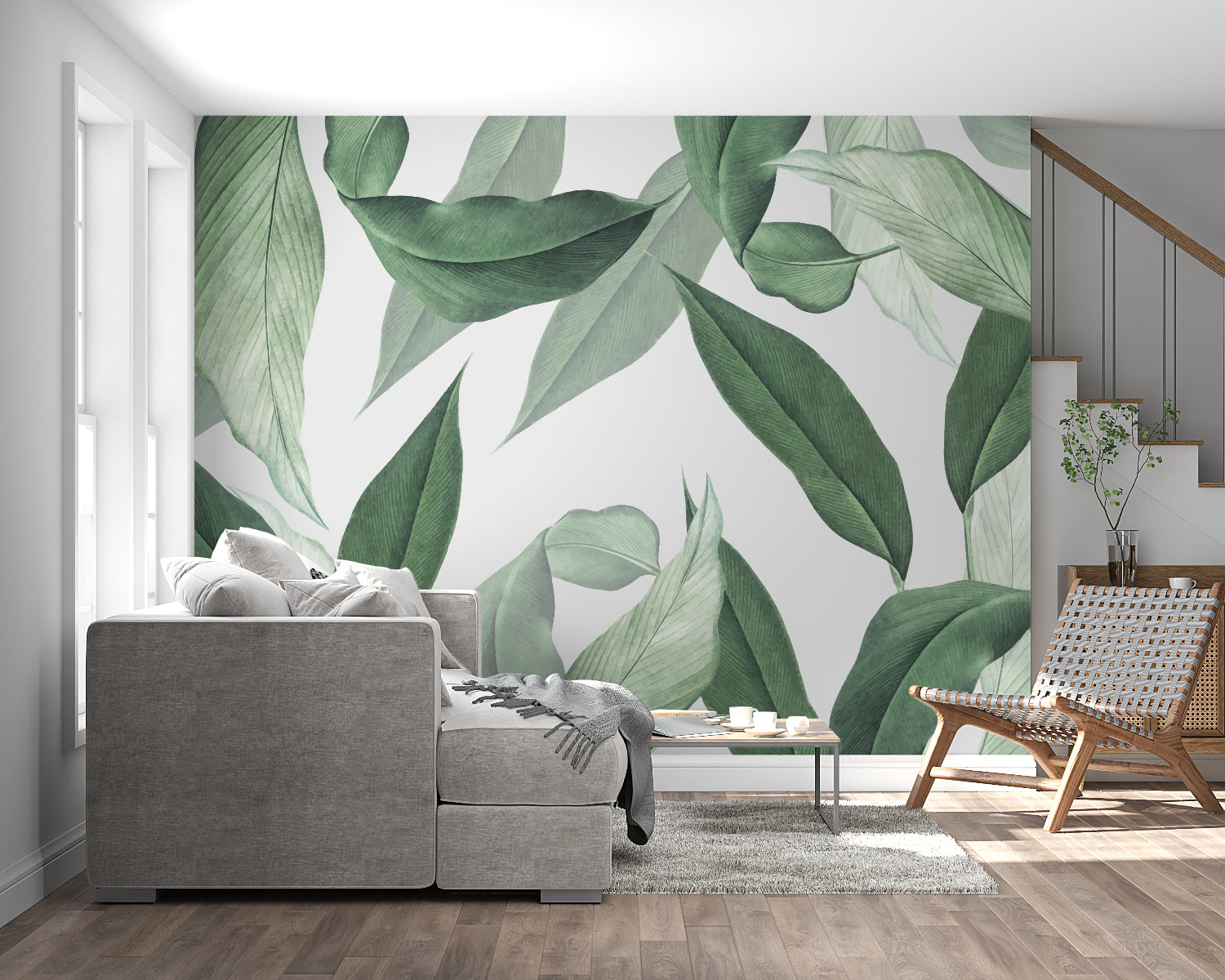 Large green leaves wallpaper in bright home office setting with wooden desk