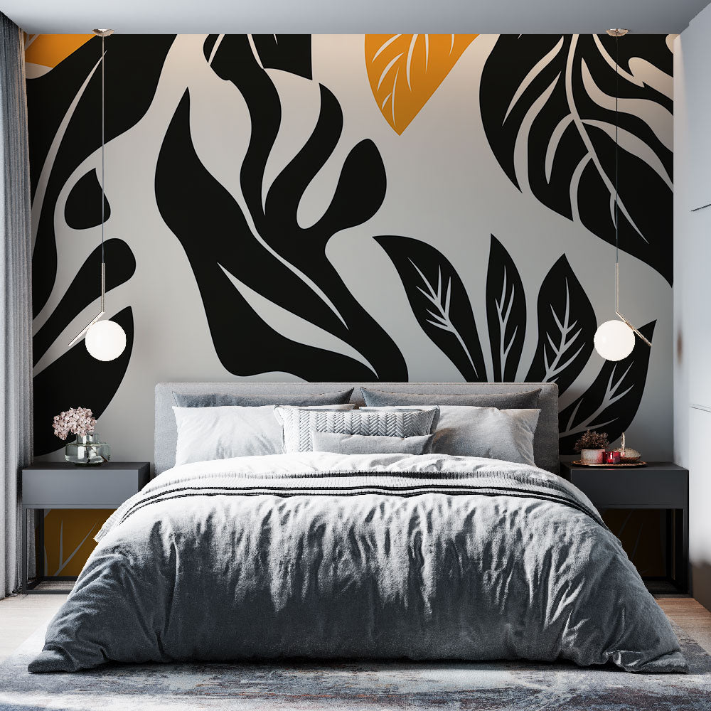 Modern black and orange Tropical Leaf Wallpaper creating a bold statement in a minimalist living room with natural light