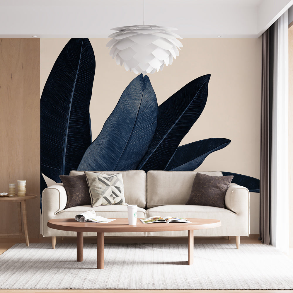 Navy blue tropical leaf wallpaper creating drama in a modern living room with natural light and minimal furniture