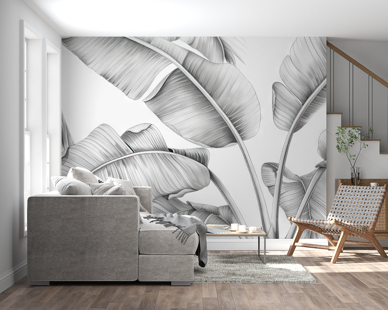 Black and white leaf mural adding style to home office with desk setup